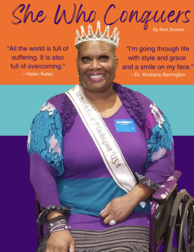 Dr. Kimberly Barrington wearing a crown and sitting in a wheelchair.