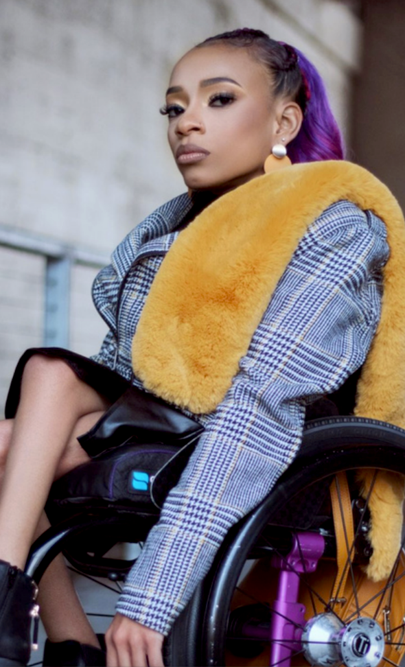 Black girl in a wheelchair. 