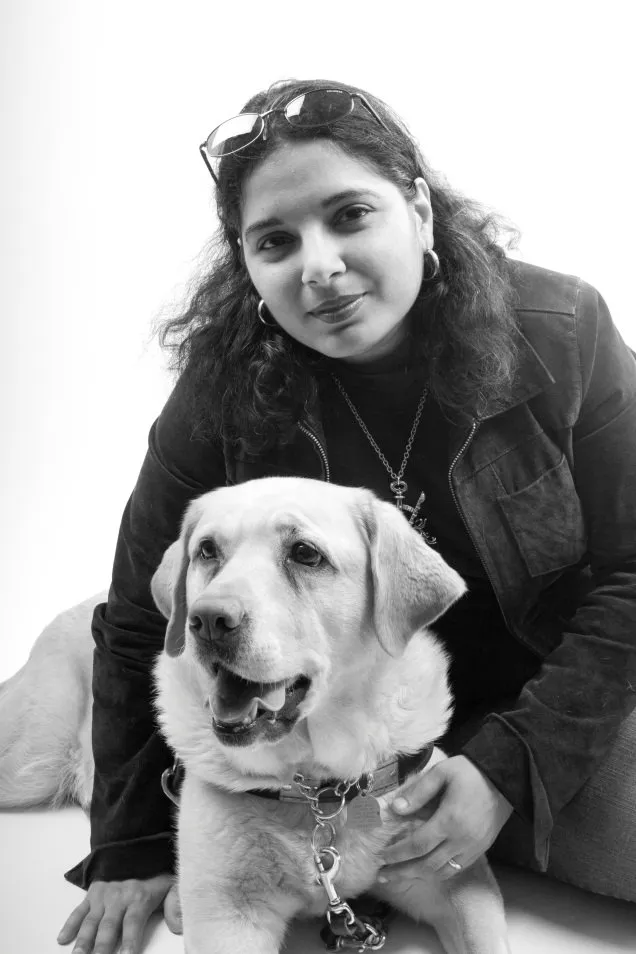 Image of Day Al-Mohamed and her guide dog. Photo Credit: Rachel Ellis